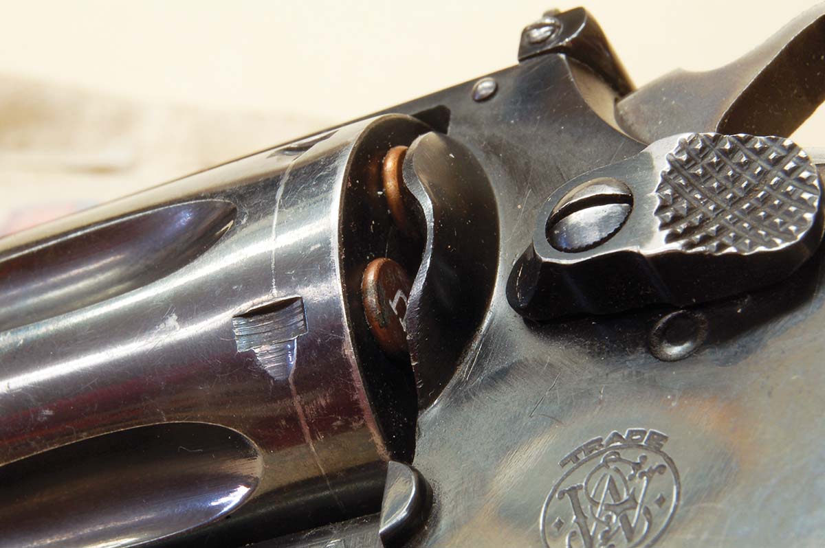 Some rifles and many revolvers like this S&W 22/32 Target had chambers not recessed for case rims, which was dangerous for bystanders if rims ruptured upon firing.